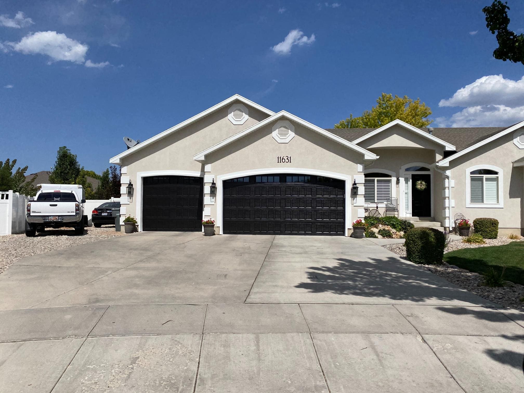 Nice suburban home with new dark garage doors