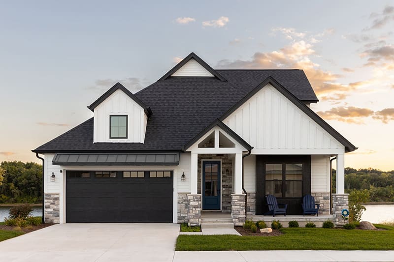 White Home with a classic raised panel garage door-